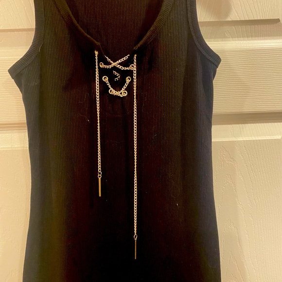 Black slightly below the knee dress by Guess with a silver chain style front. - Picture 2 of 5